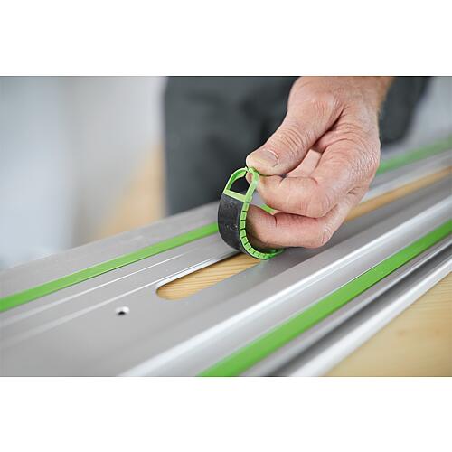 Guide rail with adhesive pad